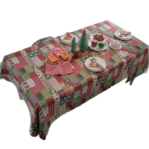 Christmas tablecloth with gingerbread man and snowflake patterns in festive red and green