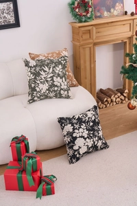 Detail of chenille jacquard cushion covers with white floral texture in Christmas setting