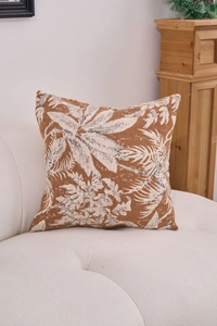 Close-up of chenille jacquard cushion cover with tropical leaf pattern on a sofa
