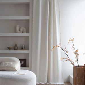 French retro cream jacquard curtains with tassels and minimalist living room scene