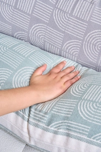 Detail of light blue jacquard pillow showing soft texture and elastic rebound quality