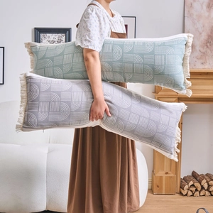 Long jacquard body pillow with geometric arch patterns and tassels for sofa or bed