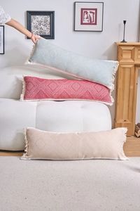 Detailed texture of bohemian jacquard lumbar pillows with decorative side tassels