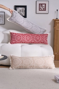Detailed view of bohemian jacquard long pillows with mandala patterns and fringe