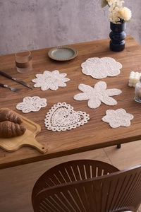 Set of six handcrafted crochet cotton coasters in cream white with intricate lace patterns