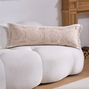 Detail of bohemian rectangle lumbar pillow with mandala jacquard and tassel trim edges