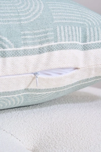 Close-up of invisible zipper and blue jacquard geometric pattern on sofa pillow case