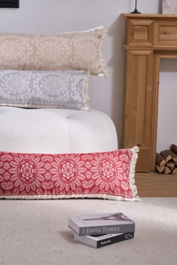 Detailed texture of jacquard lumbar pillows with mandala patterns and tassel fringe decor