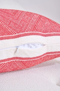 Macro detail of high-density jacquard fabric and hidden zipper on geometric lumbar pillow