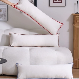 Minimalist long lumbar pillow with colored pom-pom trim for sofa and bed decoration
