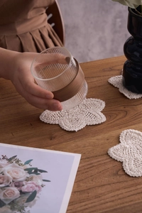 Handmade cream crochet cotton coasters with floral scalloped edges for tea sets