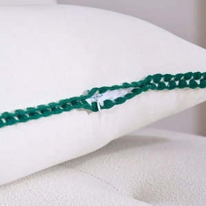 White pillow cover with green crochet lace and high-quality invisible zipper detail