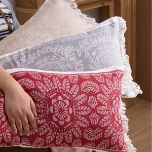 Decorative jacquard lumbar pillows with mandala patterns and fringe tassels in multiple colors