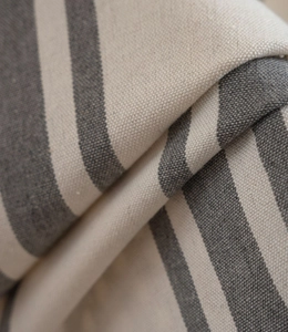 Close-up of grey and beige striped canvas fabric with thick plain weave texture