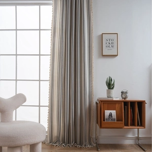 French style striped linen curtains with tassel trim in a bright Nordic living room decor