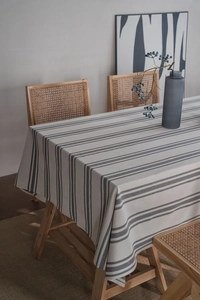 Close-up of minimalist gray and white striped linen tablecloth with soft fabric texture