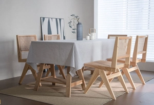 Detailed texture of minimalist striped cotton linen tablecloth in a cozy home setting