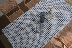 Close-up of classic black and white gingham tablecloth made of cotton linen fabric