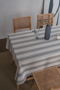 Close-up of modern striped tablecloth showing high-quality woven fabric and minimalist texture