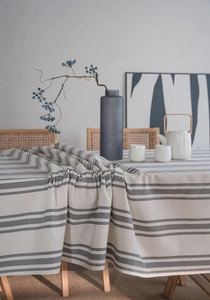 Close-up of modern striped tablecloth showing thick cotton linen texture and neutral tones