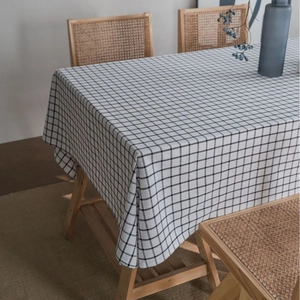 Minimalist black and white checkered cotton linen tablecloth with elegant drape and texture
