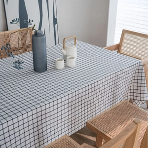 Nordic style black and white checkered linen tablecloth on a rectangular dining table