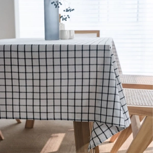Rustic black and white checkered cotton linen tablecloth in a cozy home dining setting