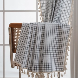 French style black and white checkered curtain fabric with beige tassels on wooden chair