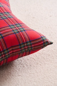 Close-up of red tartan plaid pillowcase texture with durable twill cotton weaving