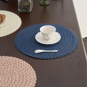 Modern woven round placemats with scallop edges in blue, white, and pink colors