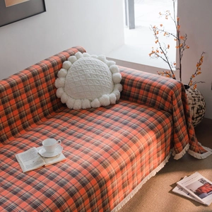 Rust red plaid sofa cover throw with white fringe tassels for cozy home decor