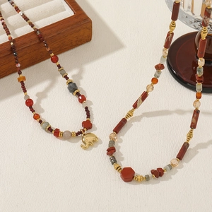 Ethnic style beaded necklaces with red agate, jasper beads and a golden elephant charm