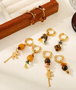 Detailed shot of vintage French earrings with agate beads and tiger eye stone accents
