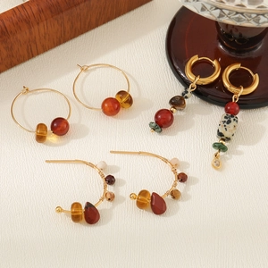 French retro gold earrings collection with agate beads and tiger eye stones in main shot