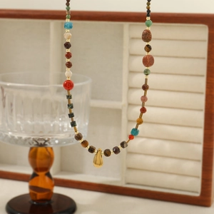 Natural African turquoise teardrop pendant necklace with colorful beads on a gold chain