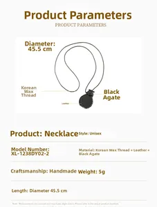 Detail view of round black agate necklace pendant with leather edge and wax cord