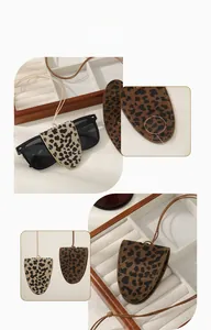 Detail showing leopard print faux suede glasses pouches with internal magnetic closure