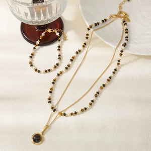 Elegantes mehrlagiges Perlenhalsketten- und Armband-Set aus Tigerauge und goldener Kette