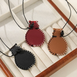 Three leather vase-shaped necklaces in red, brown, and black with hand-stitched details