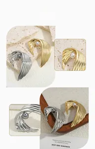 Detailed close-up of retro wing brooches with elegant pearls in gold and silver finishes