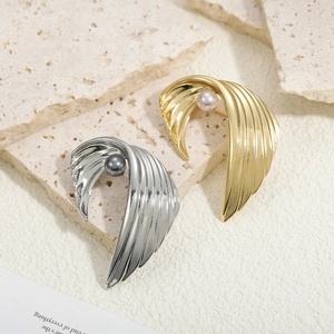 Vintage wing feather brooches with pearls in gold and silver finish on stone base