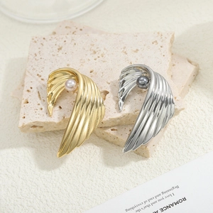 Vintage angel wing brooches in gold and silver finish with elegant pearl accents
