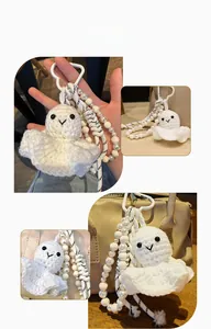 Detailed close-up of handmade white crochet ghost keychain with decorative pearl bead chain