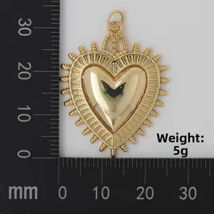 Macro shot of gold heart pendant with radial gear edges and 32mm size scale