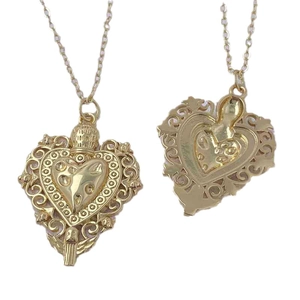 Vintage heart pendant necklace with intricate baroque engraving and polished gold finish