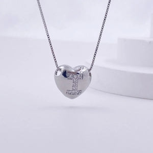 Polished silver heart pendant with letter I zircon inlay on a matching box chain
