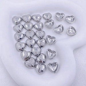 Minimalist silver heart-shaped initial necklace with white zircons in a tray