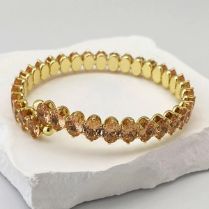 Bracelet tennis ajustable doré avec rangée de zircons ovales couleur champagne