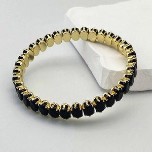 Bracelet tennis doré élégant avec pierres de zircon noir ovales et sertissage à griffes
