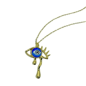 Vintage gold-plated necklace featuring a teardrop evil eye pendant on a white background